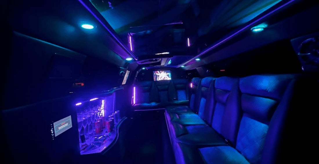 Black Chrysler Super Stretch — interior, LED-lit cabin with bar and glassware