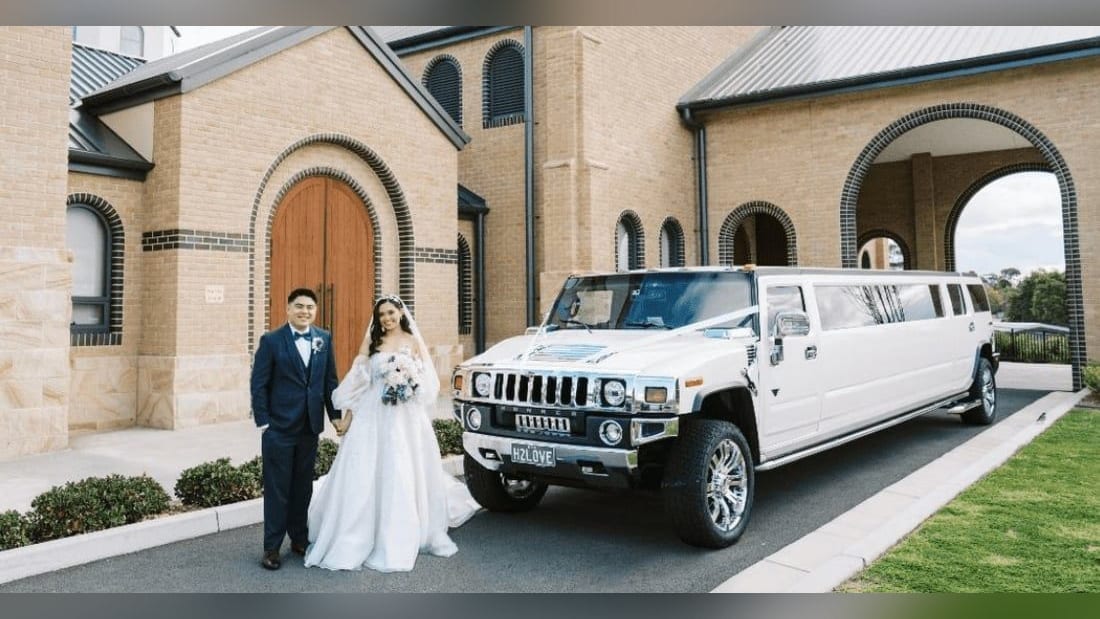 Stretch Hummer (14 Pax) — exterior, with a couple at a church