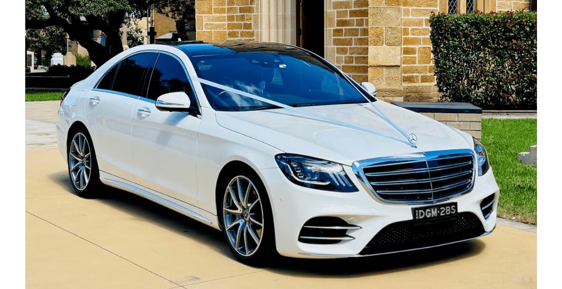 Mercedes S Class AMG Line Sedan — exterior, dressed with a wedding ribbon