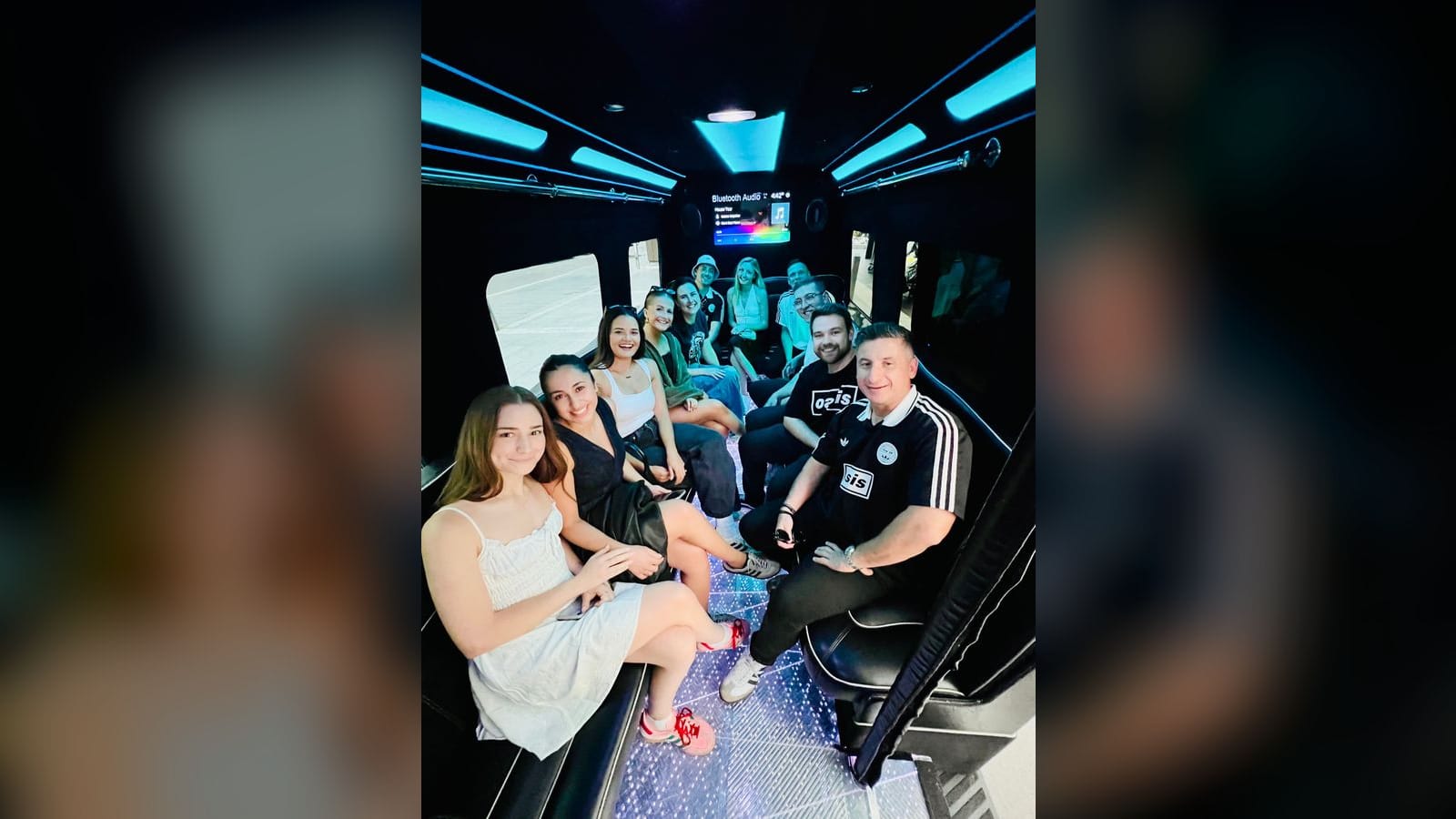 Mercedes Sprinter Limo Van — interior, party group enjoying the LED lounge cabin
