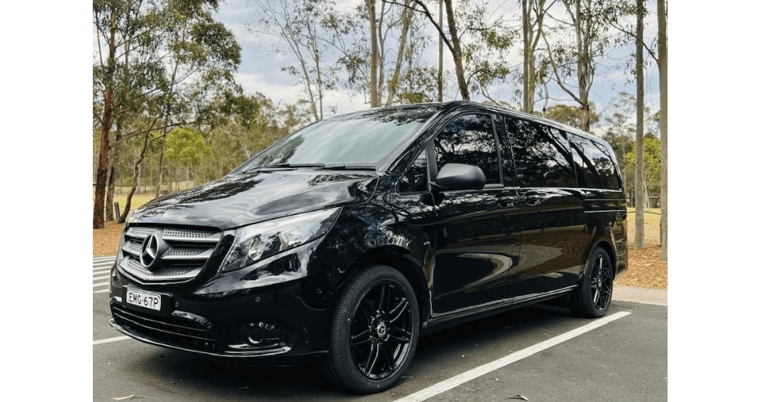 Mercedes Valente Luxury Minivan — exterior, front three-quarter in parkland